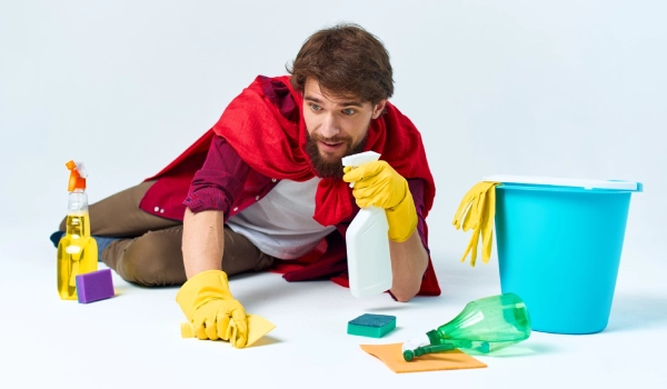 man on the floor cleaning the house